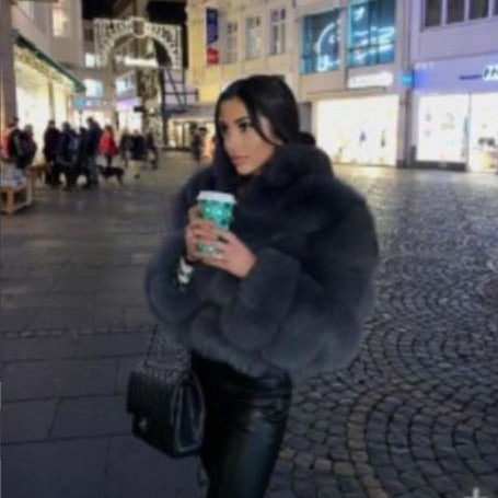 Abrigo de mujer de piel sintetica con cuello de solapa